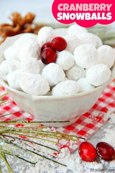 cranberry snowballs in a white bowl on a red and white checkered tablecloth