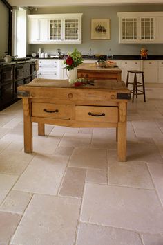 a kitchen with an island made out of wood