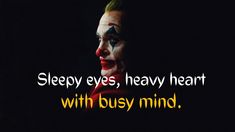 a man with his face painted in clown makeup and the words sleepy eyes, heavy heart with busy mind