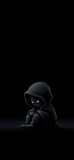 a person sitting in the dark with a hood on