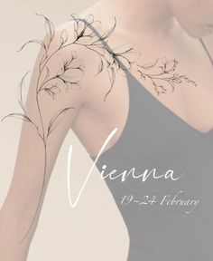 the back of a woman's arm with flowers on it and text that reads vienna