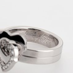 This is part of Chairish’s Fine Jewelry assortment.  Pre-owned Cartier double heart diamond ring crafted in 18k white gold (circa early 2000s).    Diamonds total an estimated 0.15 carats (estimated at G-H color and VS1-2 clarity).   The sweet double heart design is set with diamonds to one of the hearts. The ring is a smaller size (EU 47 or US 4) and is great worn on the pinky finger. Dating to the early 2000s the ring is an out of production Cartier design. The ring does not come with Cartier p Luxury Heart-shaped Diamond Ring, Luxury Heart Shaped Diamond Ring For Formal Occasions, Formal Heart Ring With Brilliant Cut, Luxury Heart Cut Diamond Heart Ring, Classic Heart Ring With Brilliant Cut For Formal Occasions, Classic Heart Shaped Diamond Ring For Formal Occasions, Luxury Heart-shaped Brilliant Cut Diamond Ring, Luxury Platinum Jewelry For Valentine's Day, Luxury Heart Cut Diamond Ring