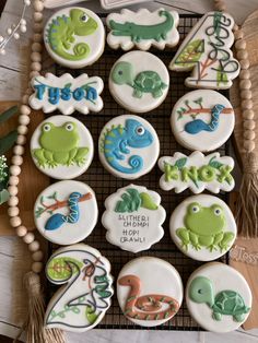 decorated cookies are arranged on a cooling rack