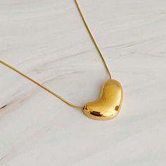 This Bold Molten Heart Necklace is as stylish as it is eye-catching. Featuring an impressive dimensionally rounded heart pendant hung on a round herringbone chain, it is sure to make any outfit stand out. Material Composition: 18k gold plated stainless steel, water and tarnish resistant Lead and Nickel free Imported Herringbone Chain, Everyday Gifts, Hair Setting, Silver Heart Necklace, Scrunchie Hairstyles, Steel Jewelry, Stainless Steel Jewelry, Hair Accessories Headbands, Steel Water