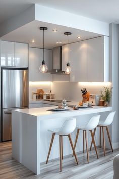 a modern kitchen with white cabinets and bar stools