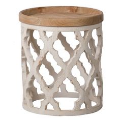 a white wooden stool with an intricate design on the top and bottom, sitting against a white background