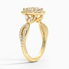 a yellow gold engagement ring with an oval shaped center stone surrounded by small round brilliant cut diamonds