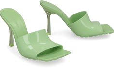 Indulge in the epitome of luxury with these exquisite rubber mules. The sleek square toe and stiletto heel exude sophistication, while the sole adorned with rubber studs adds a touch of edgy glamour. Crafted from 100% rubber, these mules are not only stylish but also durable, making them the perfect choice for fashion-forward individuals who appreciate both quality and design. Elevate your footwear collection with these logo detail rubber mules, a must-have for those who appreciate the finer thi Bottega Veneta Logo, Bottega Veneta Green, Heel Sandals For Women, Green It, Leather Cap, Pumps Flat, Sneaker Heels, Mens Sandals, Leather Jewelry