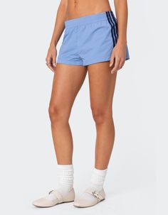 These Nylon Shorts Offer Both Style And Comfort, Making Them Perfect For A Sporty Yet Fashionable Look. They're Ideal For Any Activity, Ensuring You Feel Comfortable And Confident Throughout Your Entire Day. Shorts. Elastic Waist. Side Stripes. 100% Nylon. Model Wears Size S. Model Height Is 5'8. Item Care: Wash With Similar Color. | Edikted Nikki Nylon Shorts Sporty Nylon High-waisted Athletic Shorts, Go-dry Nylon Athleisure Shorts, Sporty Go-dry Nylon Shorts, Edikted Shorts, Sporty Nylon Shorts With Built-in Shorts, Wwe T Shirts, Flannel Sweatshirt, Graphic Trends, Boys Graphic Tee