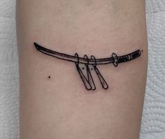 a tattoo with two knives on it