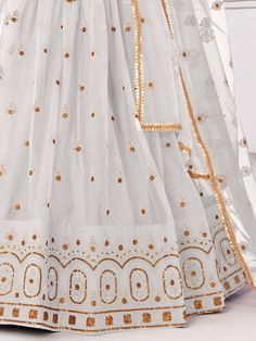 Introducing our exquisite "beautiful white sequins net festival wear lehenga choli with dupatta", a stunning ensemble that will make you stand out at any special occasion. This beautiful white lehenga features intricate embroidered work, thread work, and sequin work on butterfly net material, giving it a graceful and elegant look. The accompanying choli and dupatta are crafted from similar color butterfly net material with matching embroidered work and sequin details.
The semi-stitched lehenga c White Party Wear Anarkali Set With Sheer Dupatta, White Anarkali Set With Sheer Dupatta For Party Wear, White Anarkali Set With Mirror Work For Party, White Unstitched Sets With Zari Work, White Sharara With Traditional Drape For Party Wear, White Salwar Kameez With Zari Work For Celebration, White Choli With Sheer Dupatta For Party, White Organza Set With Dupatta, White Anarkali Sharara For Party