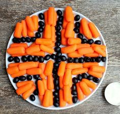 carrots and black beans are arranged on a plate