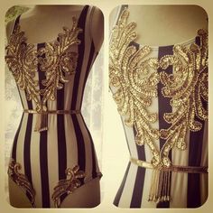 a dress with gold sequins on the back and side, in black and white stripes