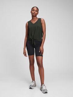 Breathable, lightweight performance jersey knit keeps you cool during your workout.  Moisture wicking helps keep your skin dry.  Four-way stretch allows freedom of movement while providing superior shape retention.  Tank straps.  V-neck.  Knot-front detail. Gap 4-way Stretch Activewear For Sports, Gap Activewear With 4-way Stretch For Sports, Gap Activewear 4-way Stretch For Sports, Gap Moisture-wicking 4-way Stretch Activewear, Fitted Gap Activewear With Go-dry Technology, Fitted Gap Activewear For Sports, Sporty Stretch Activewear By Gap, Functional Gap Activewear For Sports, Gap Fitted Go-dry Activewear