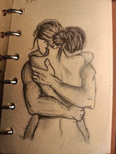 a drawing of two people hugging each other on a piece of paper with writing underneath it