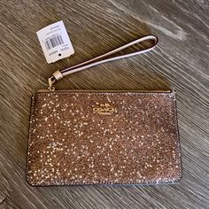 Beige Coach Wristlet Gold Glitter And Stars On Front Gold Hardware Card Slots On Inside Brand New Never Used Coach Gold Rectangular Wristlet, Gold Rectangular Coach Wristlet, Elegant Gold Coach Wristlet, Coach Gold Clutch Wristlet, Gold Coach Clutch Wristlet, Coach Gold Wristlet For Everyday Use, Coach Evening Wristlet With Wrist Strap, Gold Coach Wristlet For Everyday, Coach Clutch Wristlet For Evening