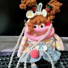 This hand-crocheted mobile phone bag is a unique and personalized fashion accessory, crafted with high quality materials. Its design is inspired by cute cartoon characters, colorful and creative, so that people can feel its unique charm at a glance. The bag is the perfect size to accommodate your phone and other small items while remaining light and easy to carry. Whether in daily life or when traveling, this mobile phone bag can be your right hand. Not only that, but it is also a beautiful piece of craftsmanship that shows the charm and virtuosity of crochet art. Whether for your own use or as a gift for friends or family, this mobile phone bag is an excellent choice. It will add a sense of fun and style to your life, so that you can feel the pleasure and convenience of it anytime and any Trendy Handmade Phone Bag For Daily Use, Cute Multicolor Handmade Crochet Bag, Handmade Multicolor Crochet Bag, Trendy Pink Crochet Bag As Gift, Handmade Multicolor Phone Bag For Gift, Cute Handmade Crochet Bag Gift, Cute Handmade Crochet Bag For Gift, Trendy Handmade Pink Crochet Bag, Trendy Pink Handmade Crochet Bag