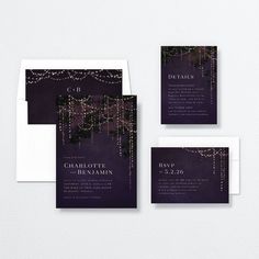 wedding stationery with purple and gold lights