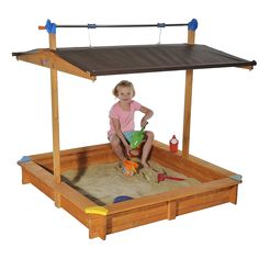 A Deluxe Children's Sandbox gives kids a fun place to play while you work in the garden. This high-quality constructed wooden covered sandbox has wonderful design features to be a lasting play place. The vinyl sandbox shade roof offers protection from sun and rain. With the retractable roof design, it can be easily cranked down to close off the sandbox when not in use. This keeps leaves and debris from collecting in the sandbox and offers a great solution to keeping cats out. Made in Austria from water-treated pine, safe for children and pets. Wood is harvested from FSC (Forest Stewardship Council)-certified, government controlled forests. This regulates the use of wood and the replanting of trees for a greener environment. Our premium sandbox is the perfect outdoor playground for little o Diy Playset, School Greenhouse, Sandbox Cover, Wooden Sandbox, Kids Sandbox, Commercial Farming, Retractable Roof, Greenhouse Kit, Custom Benches