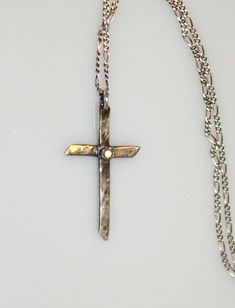 A hand-forged, hammered, sterling silver cross contrasts beautifully with a delicate, sparkling 2mm (I1) natural white diamond accent. Strung on an 18-inch sterling chain with a silver lobster claw clasp. Visit my necklace an pendant section for more handmade beauties: https://www.etsy.com/shop/MyFascinationStreet?section_id=16231287&ref=shopsection_leftnav_6 Visit my shop: www.etsy.com/shop/MyFascinationStreet Connect with me on... www.FascinationStreetDesigns.com Facebook: https://www.face Solitaire Necklace Diamond, Silver Diamond Cross Necklace, Diamond Necklace Silver, Necklace Diamond Pendant, Diamond Star Necklace, Diamond Cross Necklace, Silver Cross Necklace, Solitaire Necklace, Diamond Solitaire Necklace