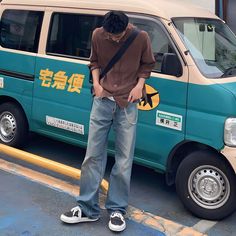 a man standing in front of a van