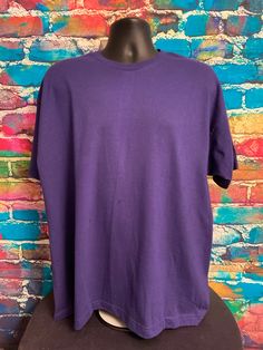 "Brand New Vintage 1993 Fruit of the Loom Casualwear Ladies Purple Plain T-Shirt. Size XL, Color: Purple, Single-Stitch, Made in USA, 100% Cotton 23 1/4\" armpit to armpit 25\" collar to bottom 28 3/4\" top to bottom" Basic Purple Short Sleeve T-shirt, Basic Purple Crew Neck T-shirt, Purple Cotton Crew Neck T-shirt, Basic Purple T-shirt With Relaxed Fit, Purple Plain Crew Neck Top, Basic Purple Plain T-shirt, Plain Purple Cotton T-shirt, Purple Crew Neck Graphic Tee, Purple Graphic Tee With Crew Neck