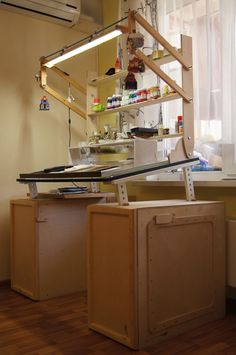 a kitchen area with cabinets and shelves in it