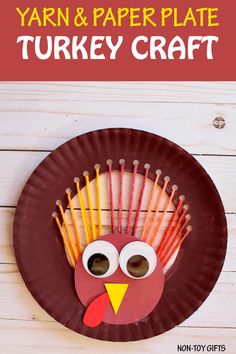 a paper plate turkey craft with straws on it