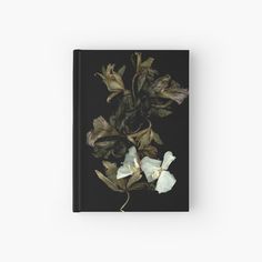 an image of flowers on a black background hardcover journal with white and green florals