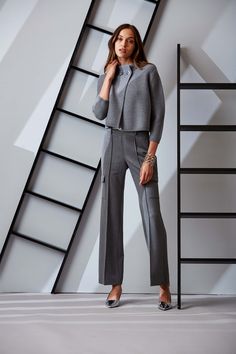 Elie chose a unique fluid flannel with a subtle shimmer to lend chic expression to the seasons must have cargo pant. The modern fit, pintuck details & cargo pockets are the definition of sporty cool. Get ready for the compliments. Elie Tahari Exclusive Metallic Stretch Cargo Pants 79% Polyester, 18% Viscose, 3% Elastane Relaxed Fit; Runs true to size. Model is 5'9" and wearing size S Measurements: Front Rise 11"L, Inseam 32.5"L (approx. length for size S) Dry clean Imported Style #: E804T204 Elegant Cargo Pants For Work In Fall, Gray Cargo Pants For Workwear, Modern Cargo Pants With Pockets For Workwear, Gray Cargo Bottoms For Workwear, Fitted Winter Cargo Pants For Workwear, Gray Cargo Pants For Fall Workwear, Gray Workwear Cargo Pants With Side Pockets, Gray Cargo Pants With Side Pockets For Work, Modern Pants With Pockets For Winter