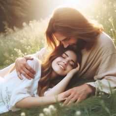 two people laying in the grass with their arms around each other and one person hugging her head