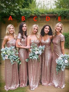 a group of women standing next to each other in front of a wall with the word abcde on it