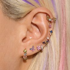 a close up of a person with ear piercings