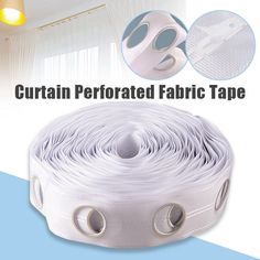 the curtain is white and has two round holes on each side, with one hole in the