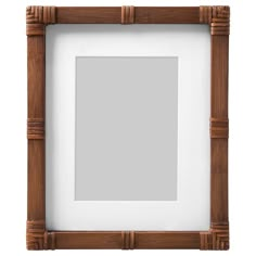 a wooden frame with a white background and wood trimmings on the bottom half