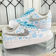 🌸 Step into your special celebration with style and grace, courtesy of our exquisite custom Nike shoes. These sneakers have been transformed to add a touch of elegance to your Sweet Sixteen or Quinceañera party, ensuring you stand out on your big day. 🌸 Who says sneakers can't be both chic and comfortable? We've redefined the rules! Our shoes are designed for dancing the night away without any discomfort. You can twirl and dance until dawn in absolute comfort. 🌸 Customization is at your fingertips! If you prefer a different color or design, simply let us know. We're here to bring your dream shoes to life. 👟 Designs and Texts: You can choose from our provided designs and texts in the personalization section or send us your own heartfelt message. ✨ RIBBON COLOR: If you'd like a different Cinderella Quinceanera Shoes, Cinderella Sweet 16 Dress, Cinderella 15 Theme, Custom Quince Shoes, Quinceanera Shoes Heels, Quince Cinderella, Quinceañera Shoes, Sweet 16 Shoes, Cinderella Quince