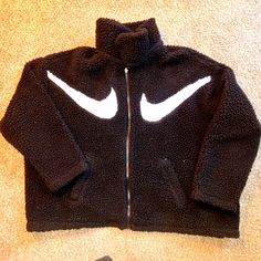 Never Worn - No Tags Nike Sportswear Double Swoosh Jacket Full Zip Black With White Swooshes Seriously Soft Hi-Loft Sherpa Fleece A Roomy Fit And Mesh Lining Help You Move Without Distraction And Layer Comfortably. Oversized Fit For A Baggy, Spacious Feel 100% Polyester Machine Washable Nike Black Fleece Jacket For Streetwear, Black Casual Fleece Jacket For Winter Sports, Casual Black Fleece Jacket For Winter Sports, Cozy Black Outerwear For Streetwear, Nike Cozy Sports Outerwear, Cozy Nike Sports Outerwear, Black Fleece Outerwear For Winter Sports, Nike Cozy Winter Outerwear, Oversized Fleece Outerwear For Sports