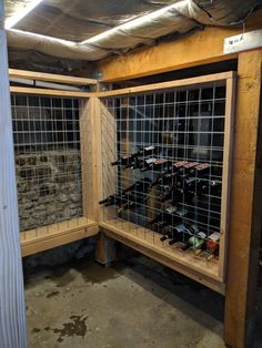 the wine rack is made out of wood and has wire mesh panels on each side