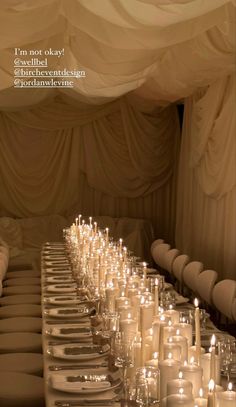 a long table is set with candles and plates for a formal dinner or wedding reception