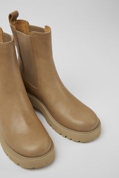 Beige leather women's Chelsea boots with OrthoLite® Recycled™ footbeds and EVA outsoles.Milah is a chunky winter boot with a distinctive urban look. Everyday Winter Boots With Rubber Sole, Winter Boots With Rubber Sole For Everyday Use, Everyday Winter Leather Boots, Everyday Ankle Boots For Winter, Everyday Winter Ankle Boots, Winter Everyday Ankle Boots, Outdoor Ankle Platform Boots With Rubber Sole, Everyday Ankle Boots With Rubber Sole, Modern Outdoor Boots With Textured Sole