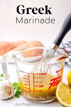 the ingredients to make greek marinade in a measuring cup