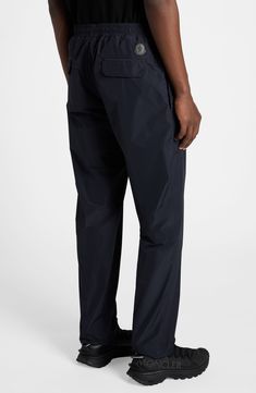 Elevate your casual look with these athleisure-inspired pants crafted from microventile léger, a high-performance fabric notable for its water-repellent properties. Elastic/drawstring waist Side-seam pockets; back flap pockets 100% polyester Machine wash, line dry Imported Designer Clothing Relaxed Fit Athleisure Bottoms For Travel, Casual Waterproof 4-way Stretch Bottoms, Relaxed Fit Moisture-wicking Travel Bottoms, Moisture-wicking Relaxed Fit Travel Bottoms, Moisture-wicking Relaxed Fit Bottoms For Travel, Functional Straight Leg Parachute Pants, Relaxed Fit Functional Travel Bottoms, Sporty Travel Bottoms With 4-way Stretch, Sportswear Bottoms With Functional Pockets And 4-way Stretch