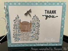 a thank you card with an image of a fence and flowers on the front side