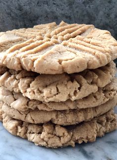 a stack of cookies sitting on top of a marble counter