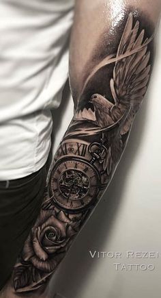 a man with a clock and roses tattoo on his arm