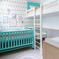 a child's room with bunk beds and wallpaper