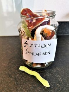 a jar filled with lots of different types of candies