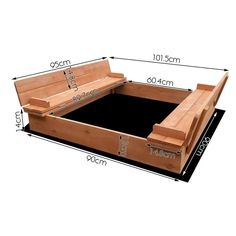 a wooden bench sitting on top of a black floor next to a white wall with measurements