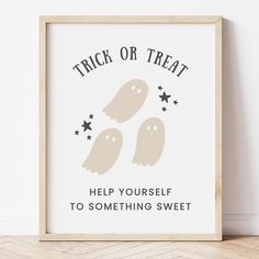 a framed poster with two ghost saying trick or treat help yourself to something sweet