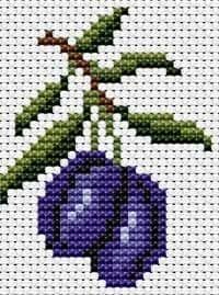 a cross stitch pattern with a blue berry on it